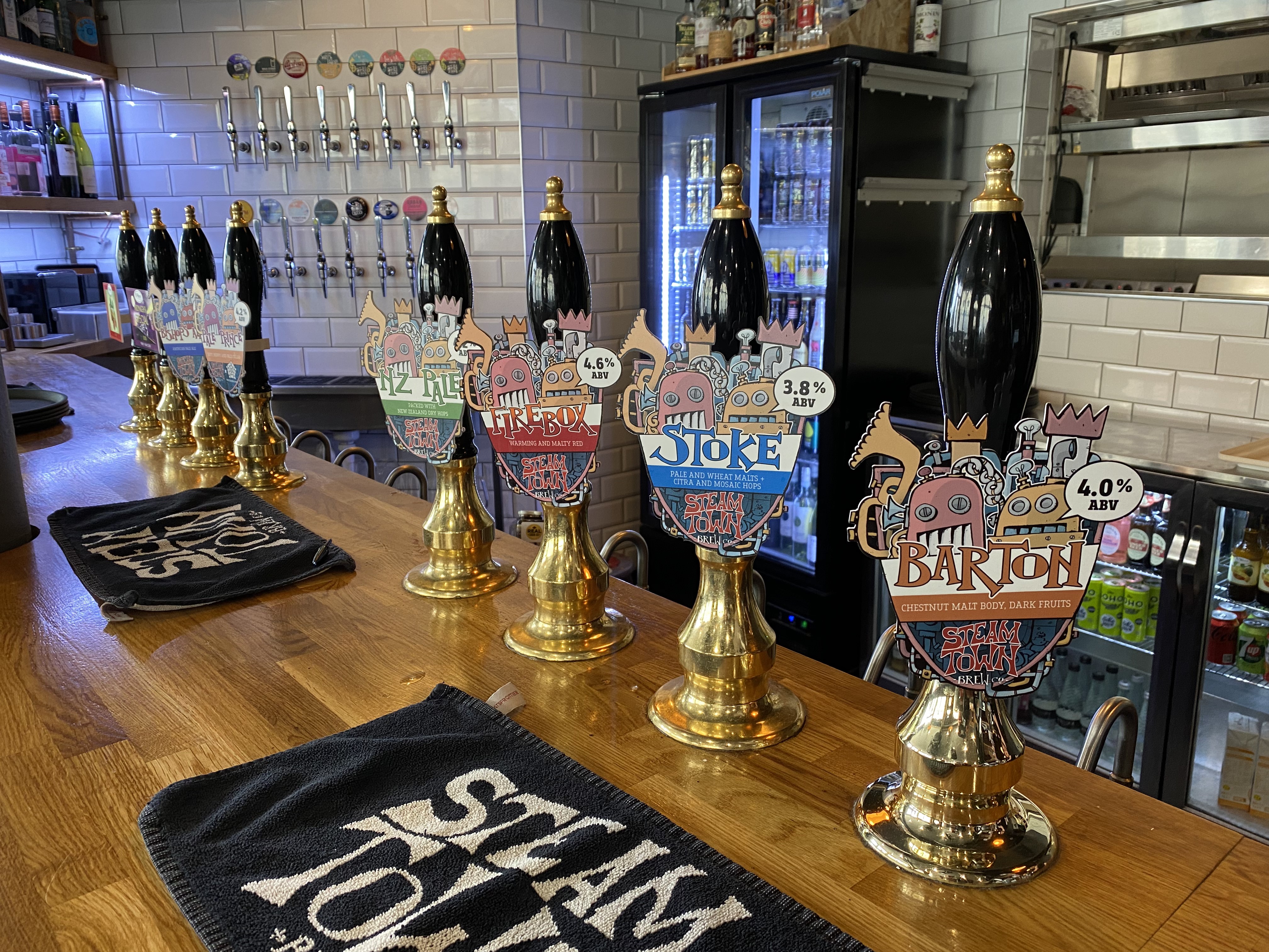 Steam Town Brew Co - Handpumps and keg fonts at the bar